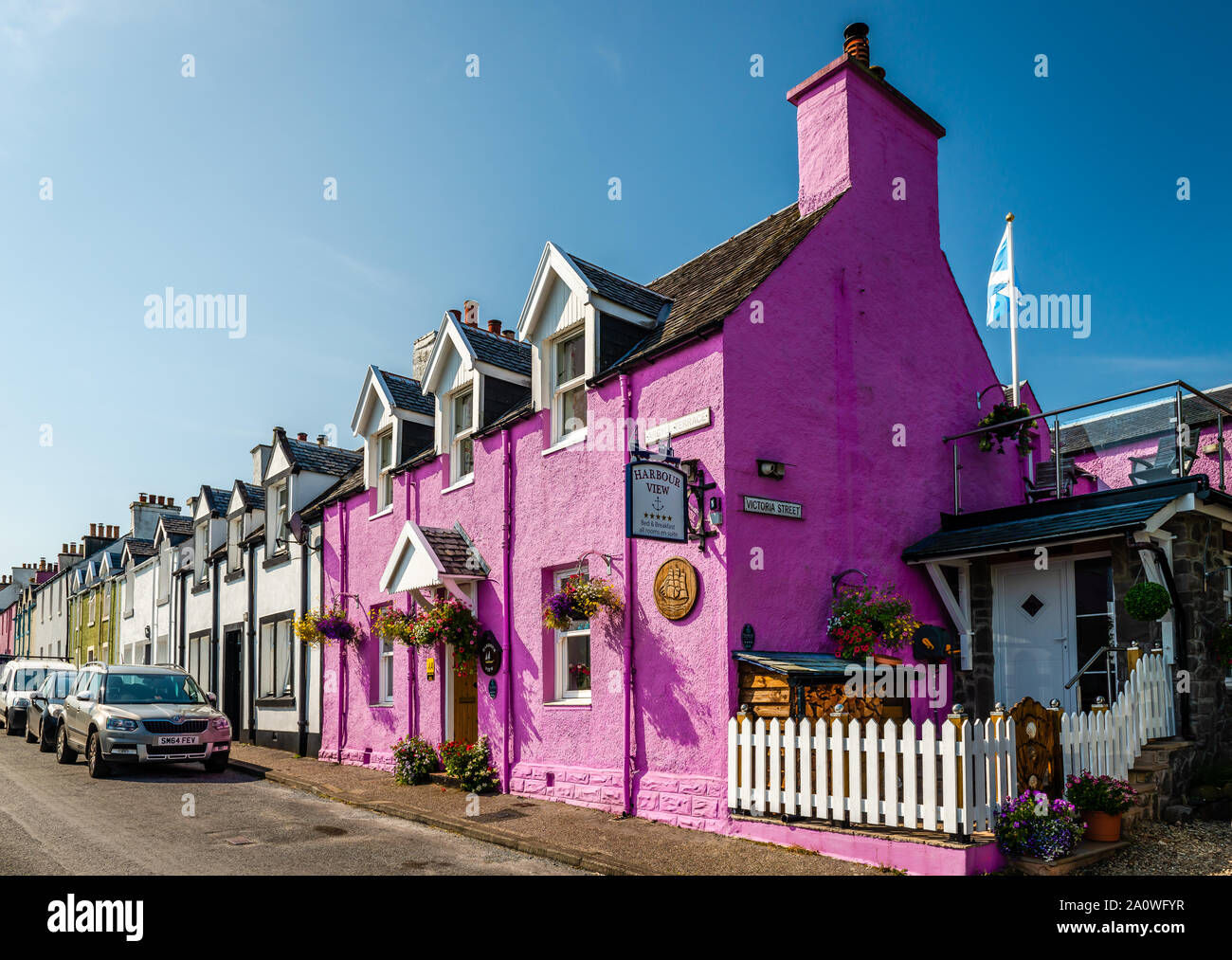 View of buildings in Argyll Terrace, a street in upper Tobermory, that has magnificent view over the Bay and the Sound of Mull. Isle of Mull, Scotland. Stock Photo