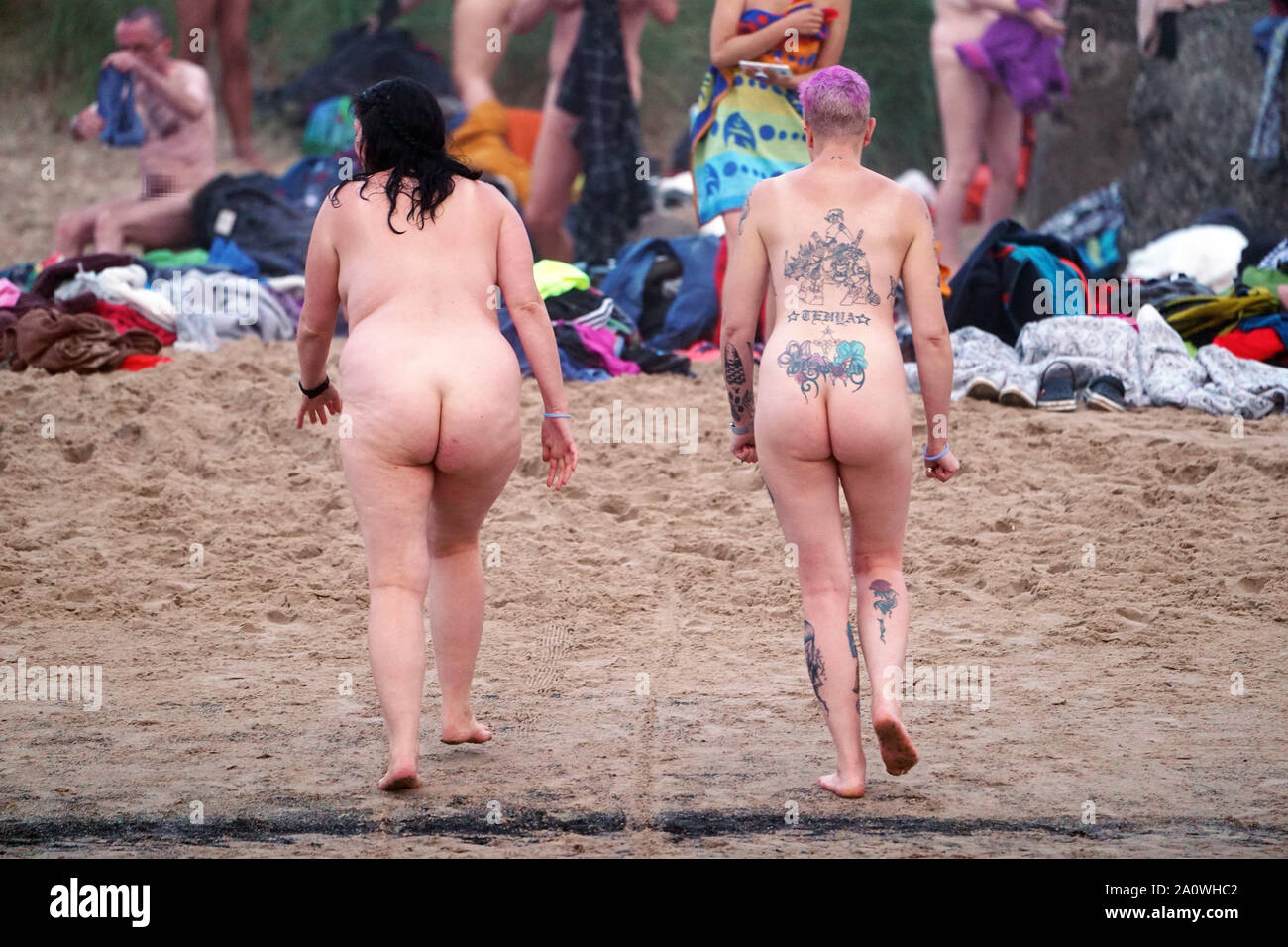 NOTE NUDITY People take part in the North East Skinny Dip at Druridge Bay  in Nothumberland, an annual event that marks the Autumn Equinox and raises  money for MIND - the Mental