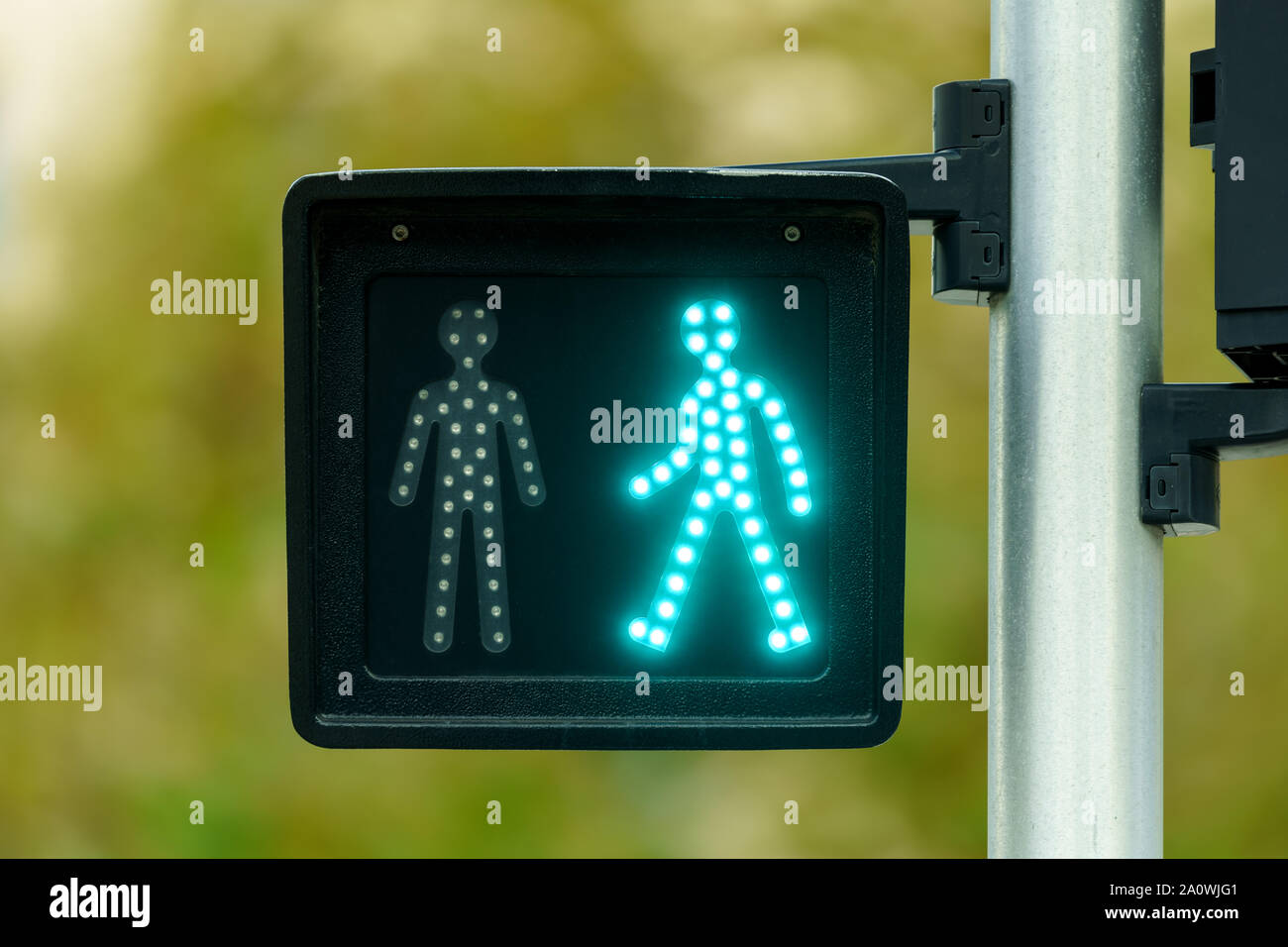 Pedestrian traffic light with green light lit Stock Photo - Alamy