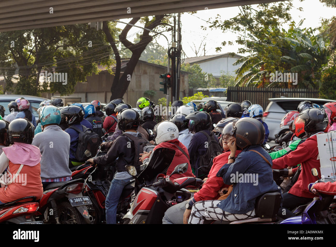 Jakarta / Indonesia June 09 2018 Crush of scooters waiting for the