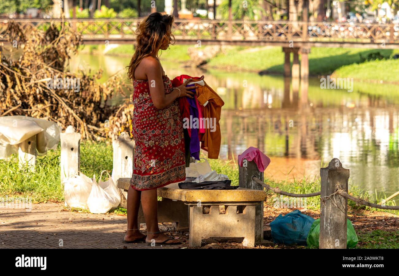 Siem Reap / Cambodia - October 26 2018: Homeless woman by the river in Siem Reap Cambodia Stock Photo