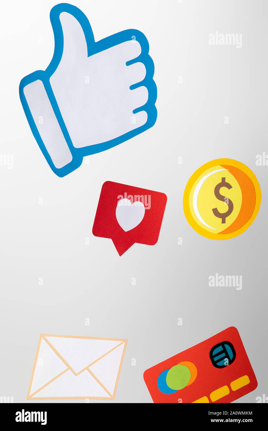 paper icons with envelope, coin, credit card, hearts and thumb up on white background Stock Photo