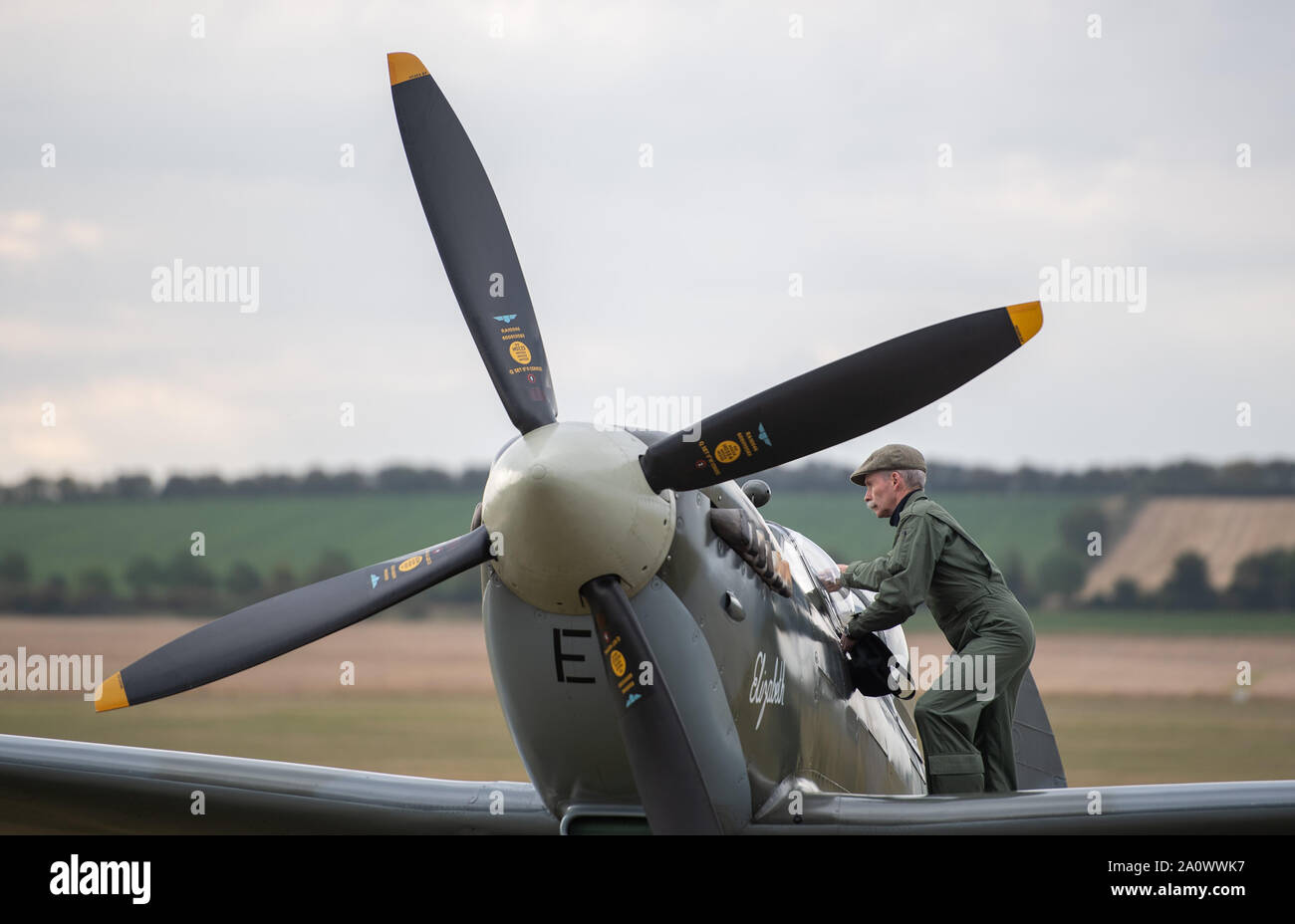 Pilot Charlie Brown opens the canopy of his Supermarine Spitfire during the Duxford Battle of Britain Air Show at the Imperial War Museum in Duxford, Cambridgeshire. Stock Photo