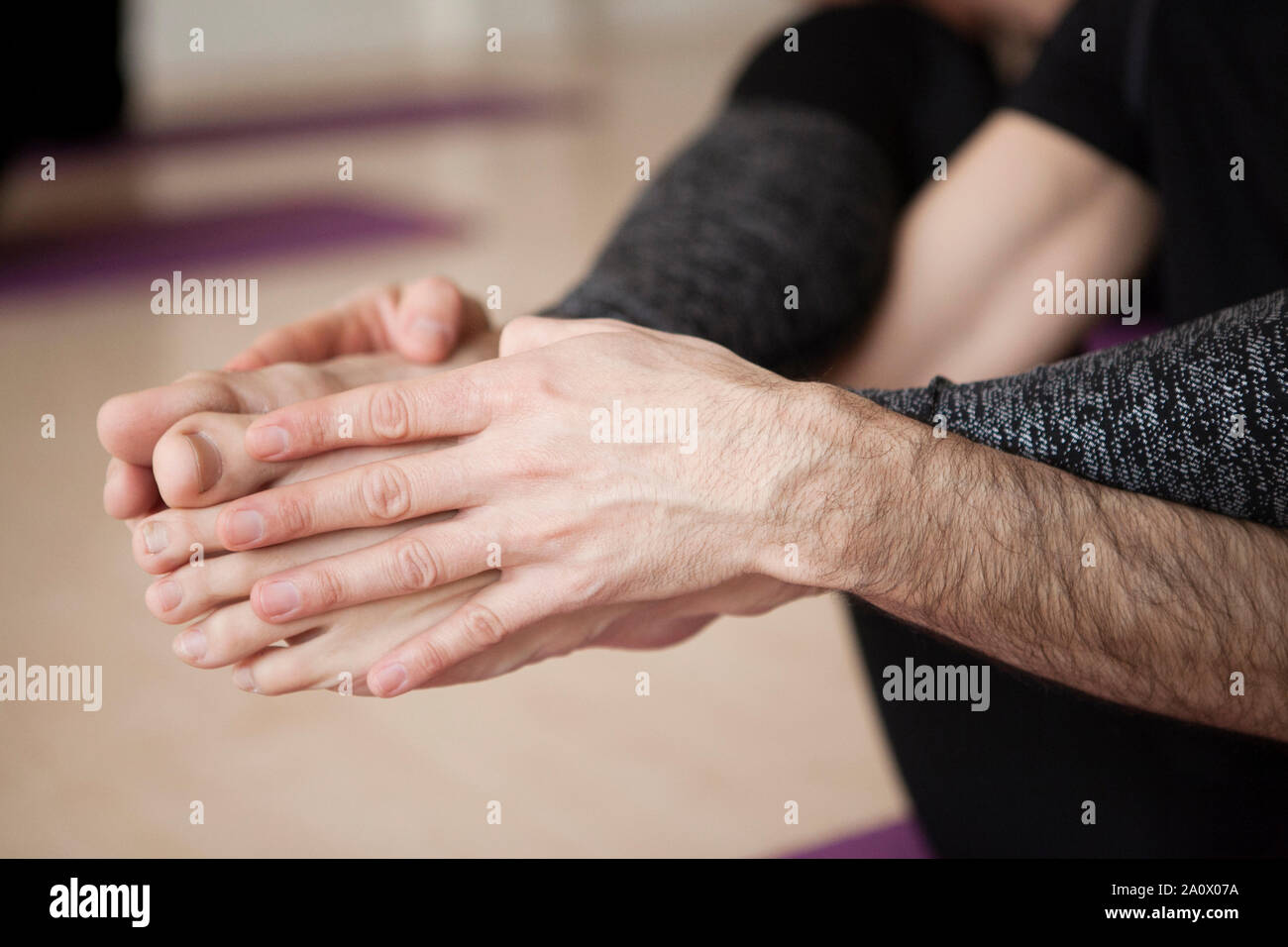 Yoga position, close up of legs and hands Stock Photo