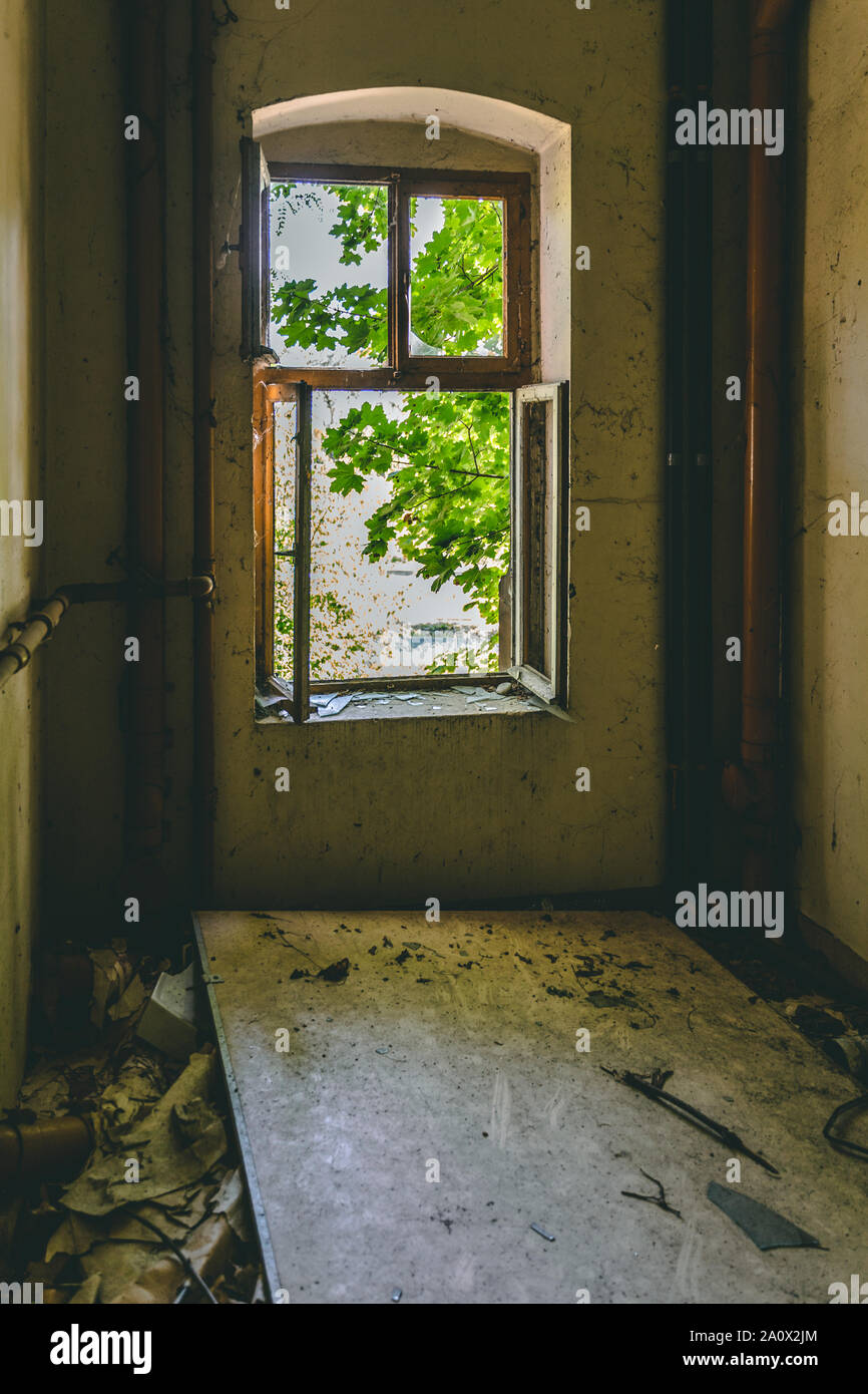 Open old window in a deserted building Stock Photo