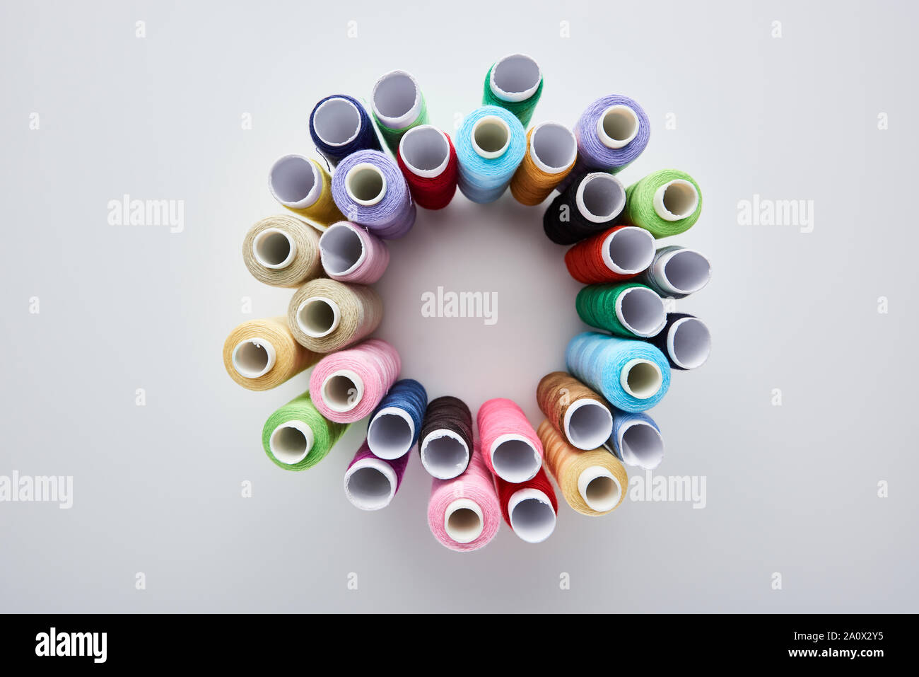 Thread View From Top Side top view of bright and colorful threads on white background Stock Photo ...