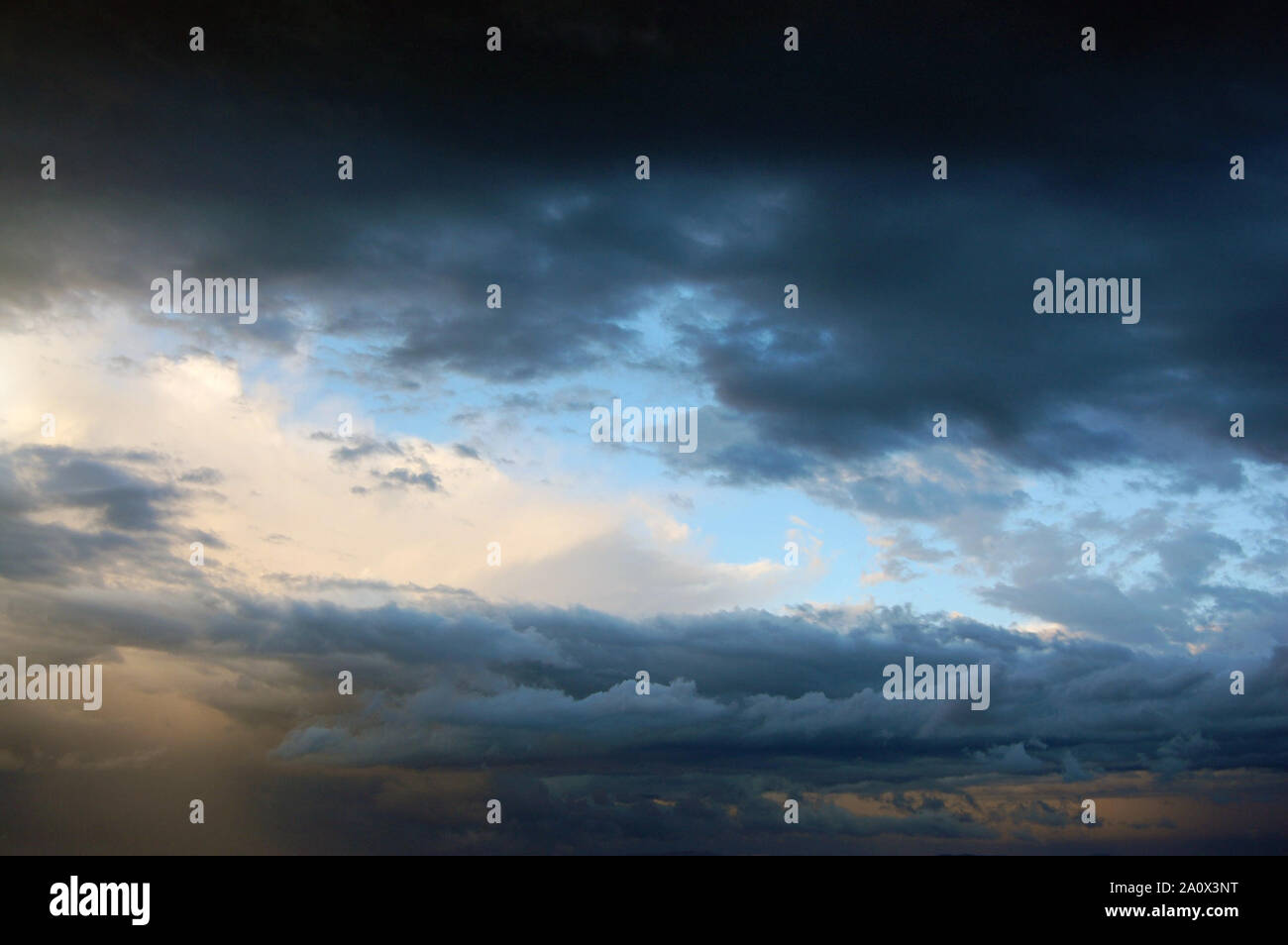 Colorful bluish cloudscape in the evening sky Stock Photo
