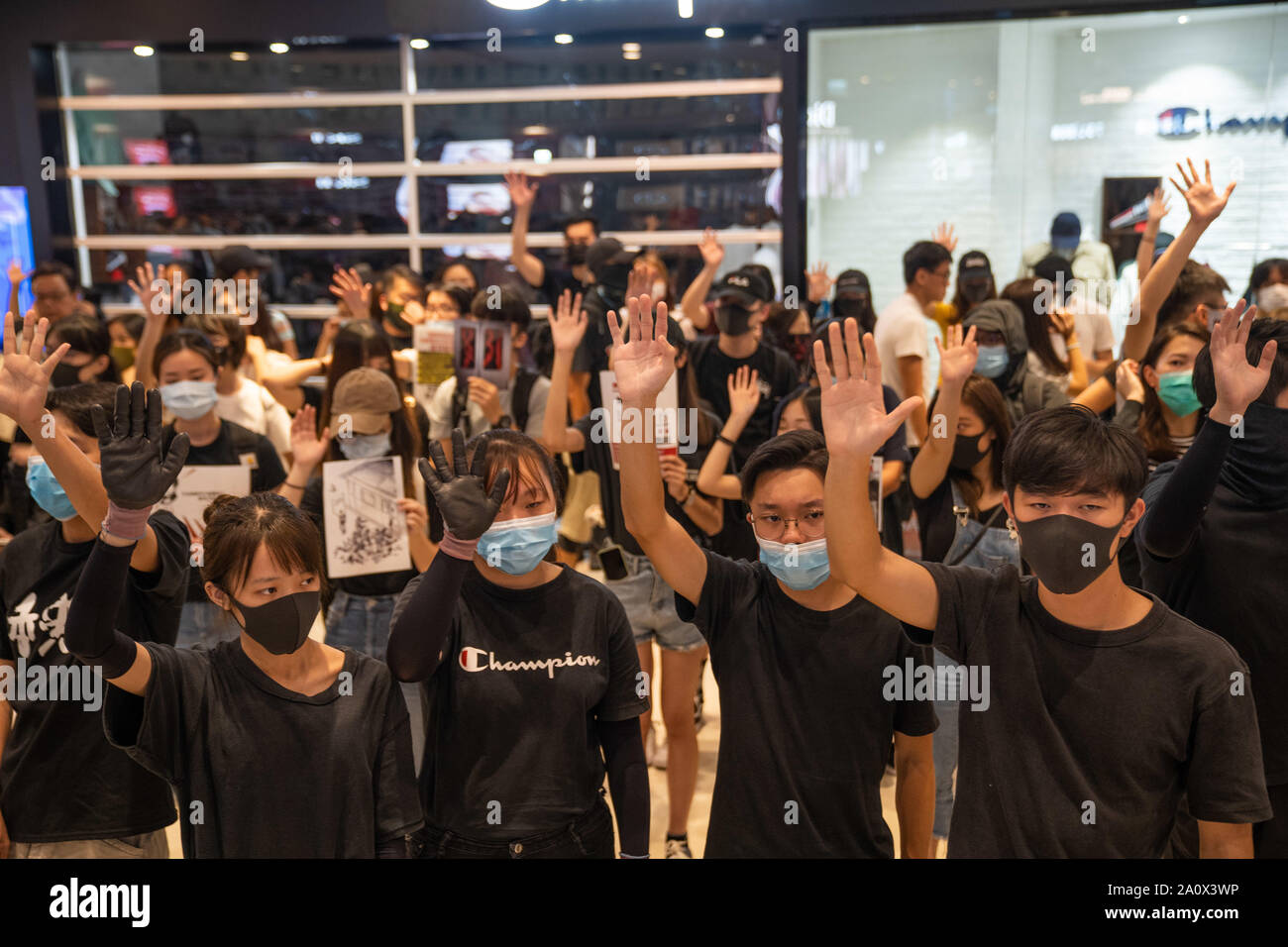 Pro-democracy protesters sing songs and shout slogans as they gather in a shopping mall during a rally in Yeun Long.Pro-democracy protesters have continued demonstrations across Hong Kong, calling for the city's Chief Executive Carrie Lam to immediately meet the rest of their demands, including an independent inquiry into police brutality, the retraction of the word “riot” to describe the rallies, and genuine universal suffrage, as the territory faces a leadership crisis. Stock Photo