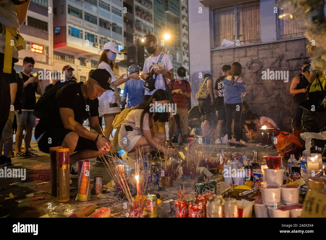 People burn incense to pay tribute  to those who lost their lives  in the Prince Edward MTR station on 31 of August. Pro-democracy protesters have continued demonstrations across Hong Kong, calling for the city's Chief Executive Carrie Lam to immediately meet the rest of their demands, including an independent inquiry into police brutality, the retraction of the word “riot” to describe the rallies, and genuine universal suffrage, as the territory faces a leadership crisis. Stock Photo