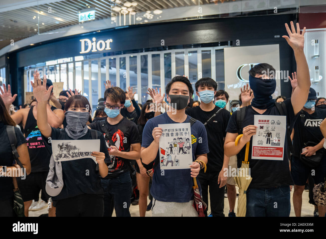 Pro-democracy protesters sing songs and shout slogans as they gather in a shopping mall during a rally in Yeun Long.Pro-democracy protesters have continued demonstrations across Hong Kong, calling for the city's Chief Executive Carrie Lam to immediately meet the rest of their demands, including an independent inquiry into police brutality, the retraction of the word “riot” to describe the rallies, and genuine universal suffrage, as the territory faces a leadership crisis. Stock Photo