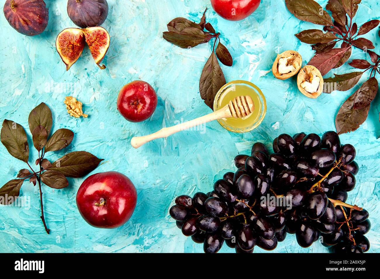 Autumn food still life with season fruits grape, red apples and figs ...