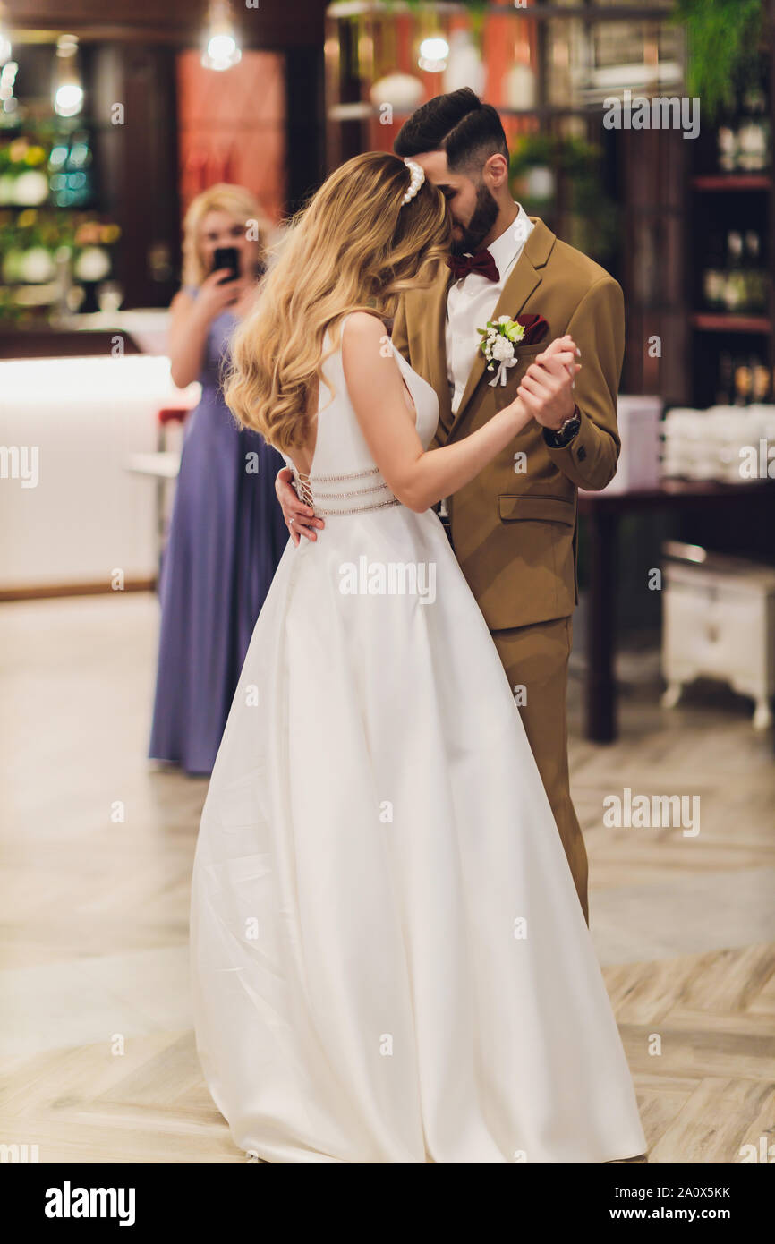 Stylish Happy Bride And Groom Posing At Big Love Word In Evening