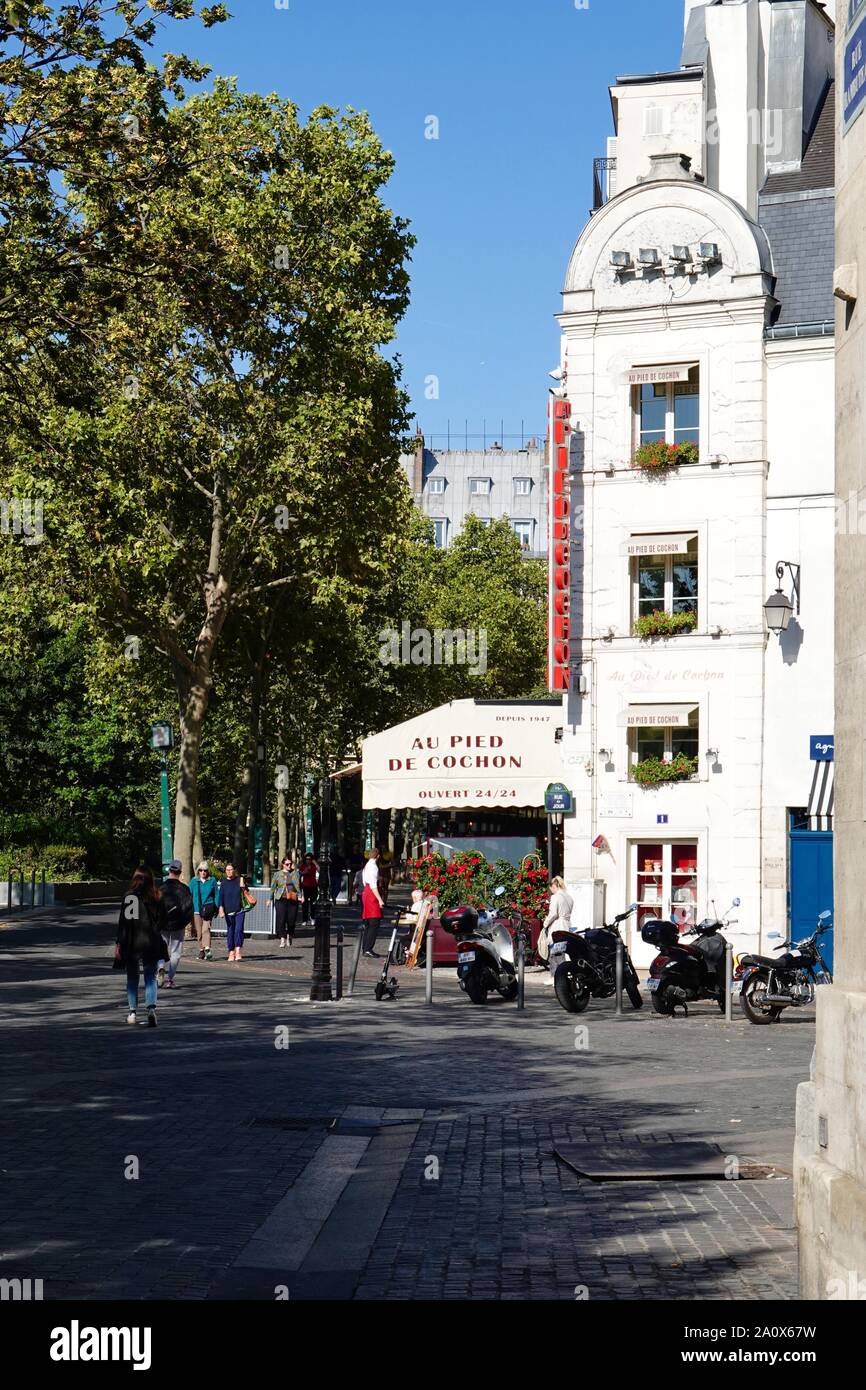 Pedestrians passing in front of Au Pied de Cochon Restaurant, brasserie, restaurant, at Les Halles, Paris, France Stock Photo