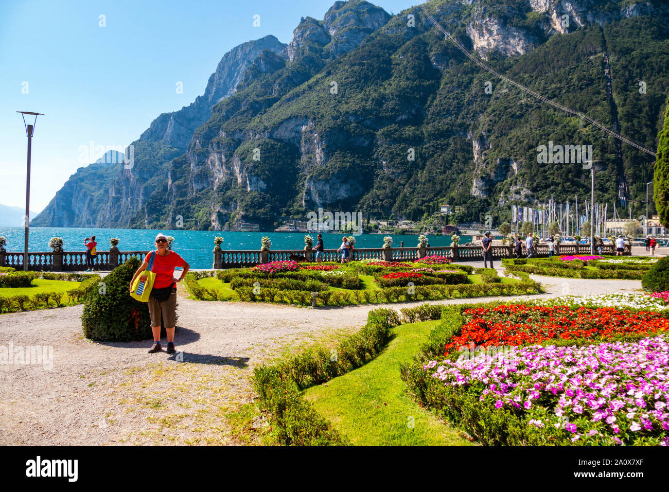 Colourful flowerbeds and mountains, Lake Garda, Riva del Garda, Trentino, Alto Adige, Northern Italy Stock Photo