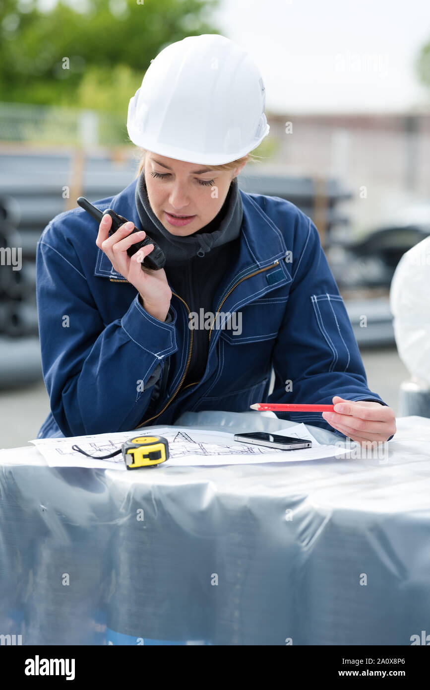 female worker using walkie Stock Photo