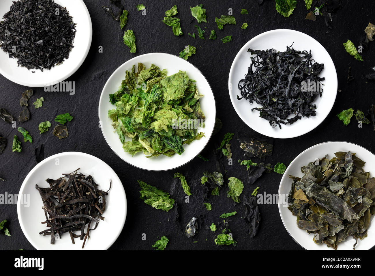 Various dry seaweed, sea vegetables, shot from above on a black background Stock Photo
