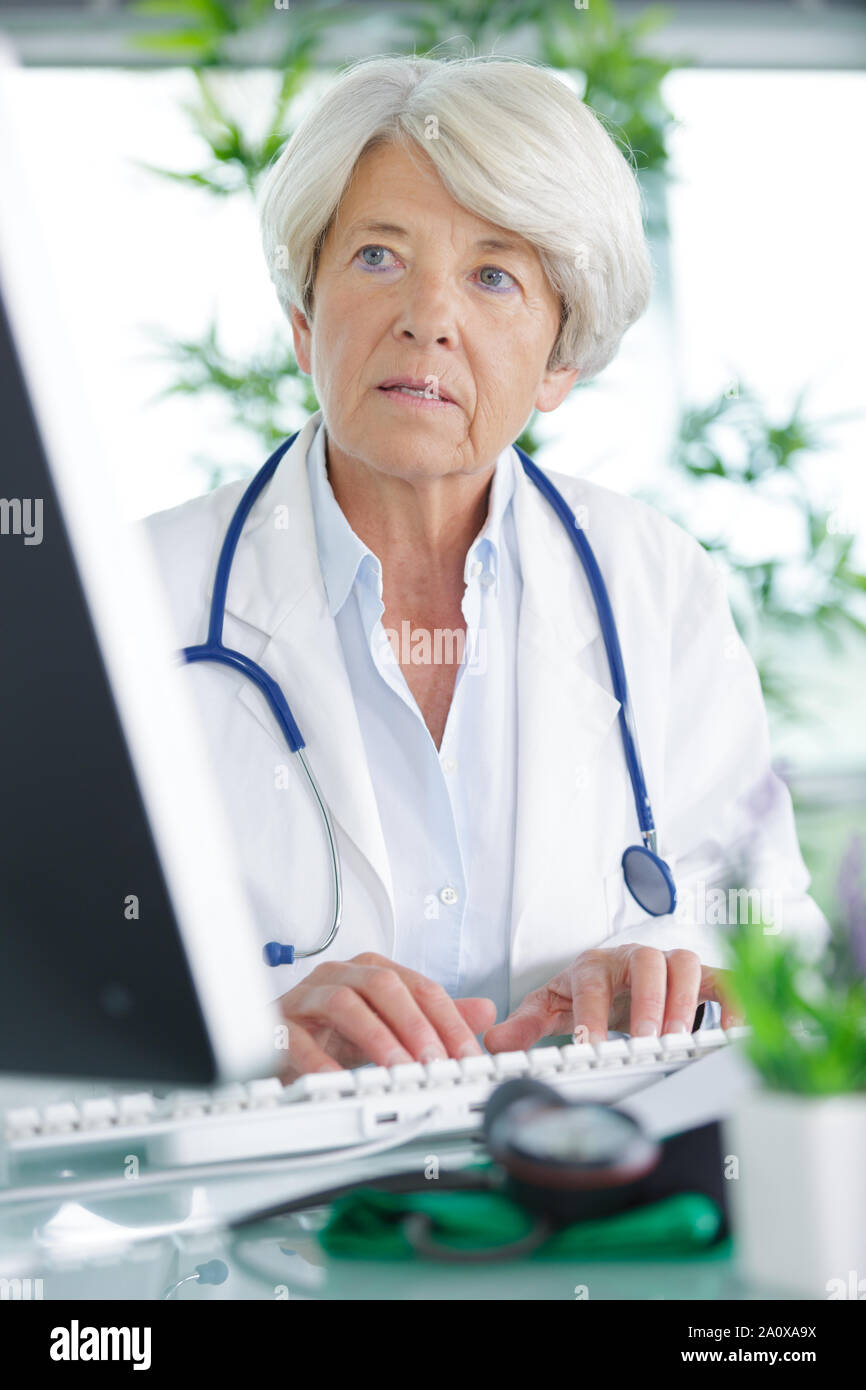 Mature man asking doctor hi-res stock photography and images - Alamy