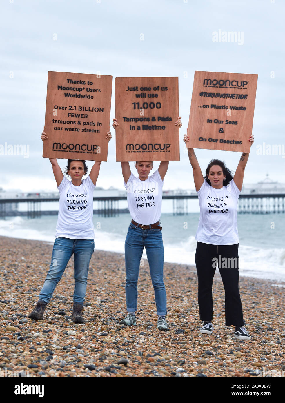 Brighton UK 22 September 2019 - From left Kath Clements , Jana Szczepaniak  and Rebecca Manning at the Mooncup "Turning the Tide" beach clean in  Brighton today as part of the Marine