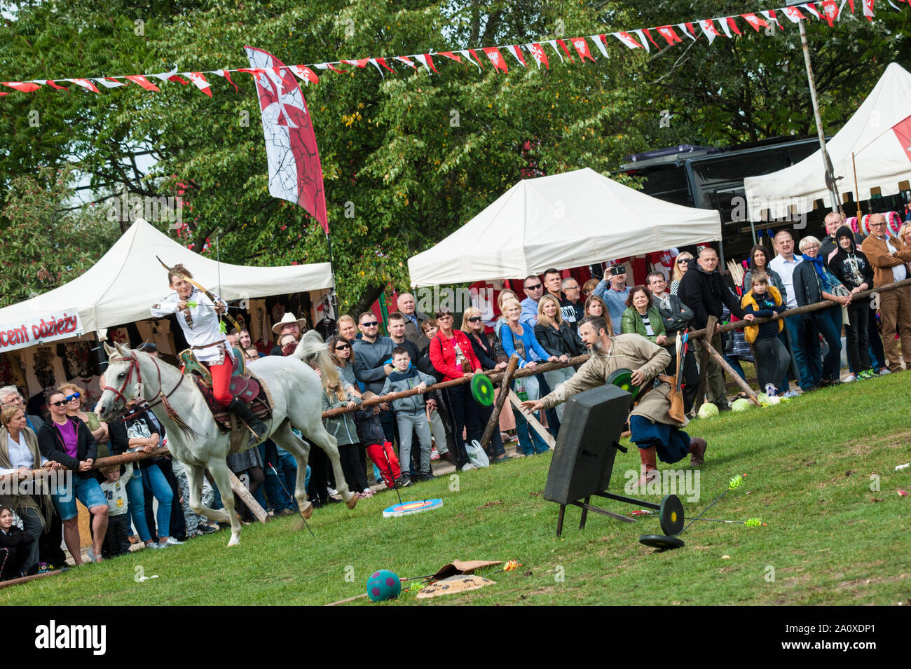 Live demonstration of equine archery by both sexes during a festival of historical combat at the Pultusk Castle in central Poland. Stock Photo
