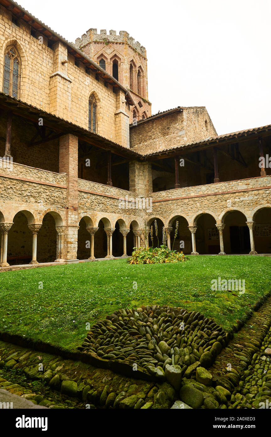Romanesque cloister and bell tower of Saint-Lizier Cathedral historical monument (Saint-Lizier, Ariège, Occitanie, Pyrenees, France) Stock Photo