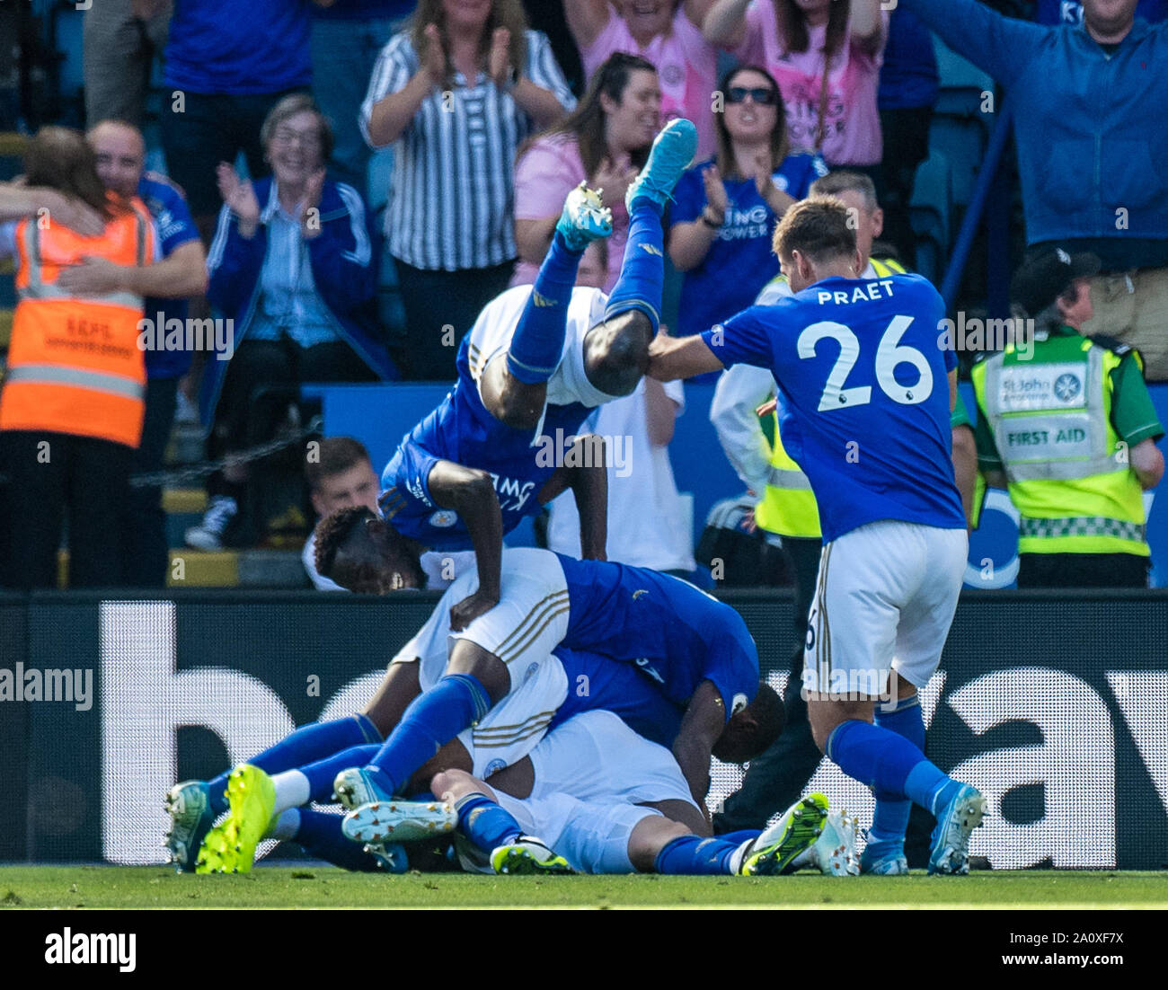 LEICESTER, ENGLAND - SEPTEMBER 21: James Maddison,of Leicester City celebrate with he’s team mates Demarai Gray, Ricardo Pereira and Wilfred Ndidi after scoring goal during the Premier League match between Leicester City and Tottenham Hotspur at The King Power Stadium on September 21, 2019 in Leicester, United Kingdom. (Photo by Sebastian Frej/MB Media) Stock Photo