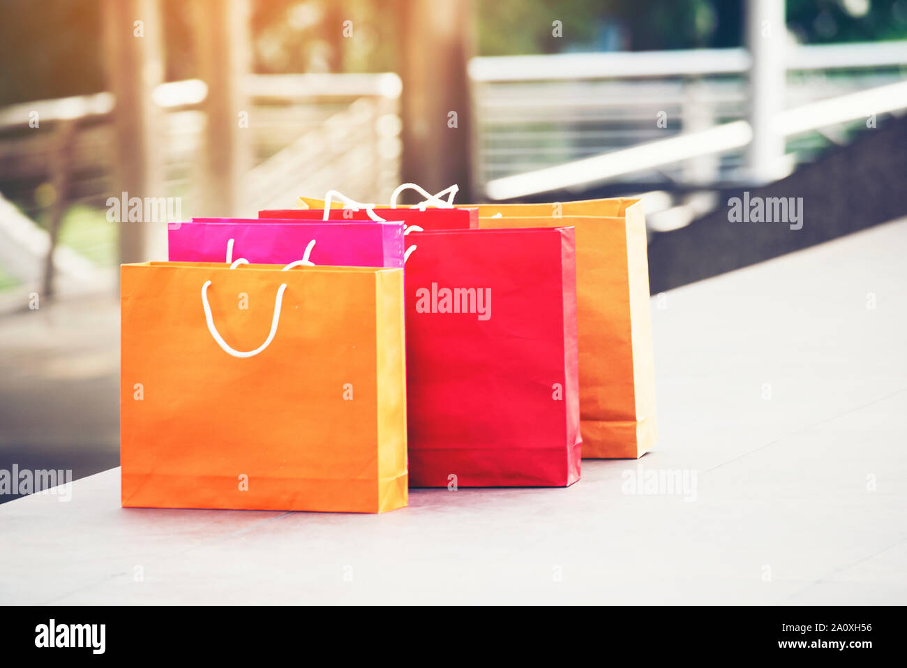 Shopping bags of women crazy shopaholic person at shopping mall. Woman love online shopping website with sales tags. E-commerce Bag Concept. Stock Photo