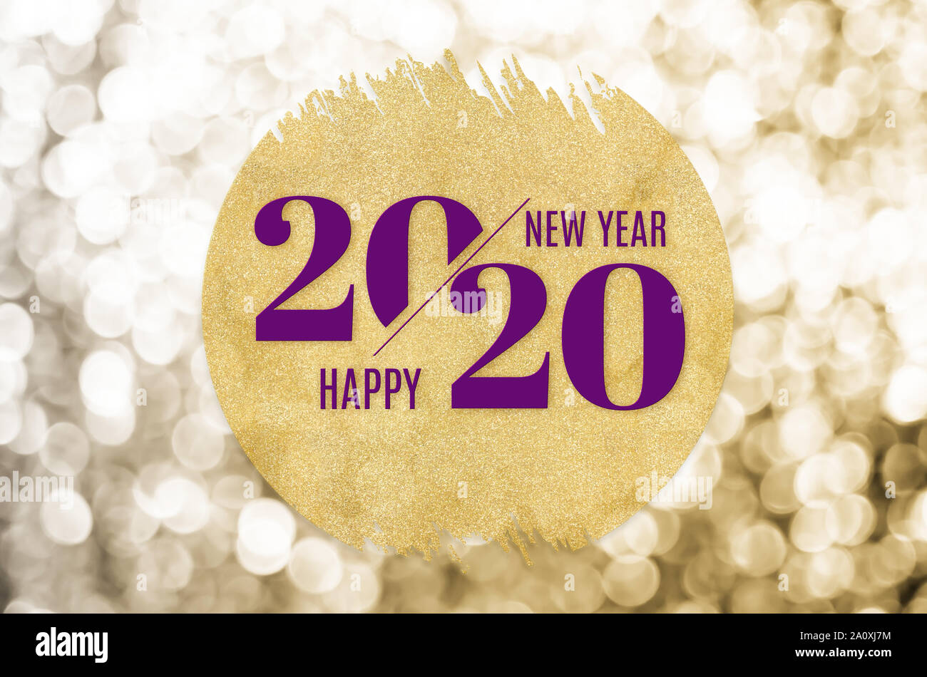 Happy new year 2020 word on gold circle glitter on gold bokeh sparkle background,minimal Holiday greeting card. Stock Photo