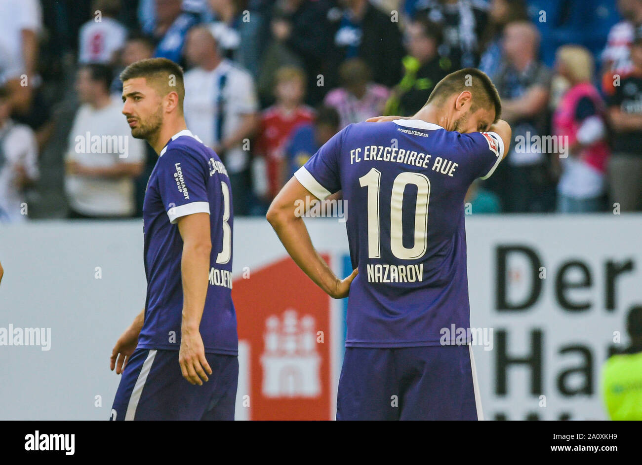 Hamburg, Germany. 22nd Sep, 2019. Soccer: 2nd Bundesliga, Hamburger SV - Erzgebirge Aue, 7th matchday. Aues Tom Baumgart (l) and Aues Dimitrij Nazarov stand on the square after the final whistle. Credit: Axel Heimken/dpa - IMPORTANT NOTE: In accordance with the requirements of the DFL Deutsche Fußball Liga or the DFB Deutscher Fußball-Bund, it is prohibited to use or have used photographs taken in the stadium and/or the match in the form of sequence images and/or video-like photo sequences./dpa/Alamy Live News Stock Photo