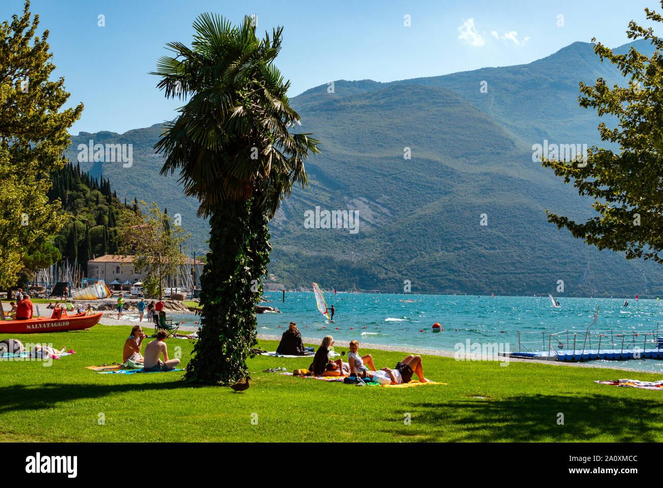 Windsurfers and yachts, Lake Garda, Riva del Garda, Trentino, Alto Adige, Northern Italy Stock Photo