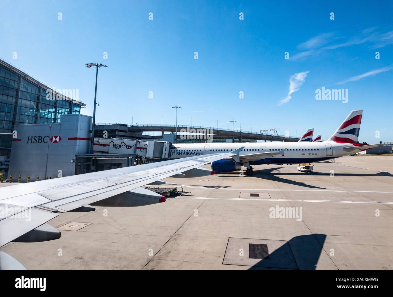 View from plane window of British Airways aeroplane on airport apron, Heathrow airport, London, England, UK Stock Photo