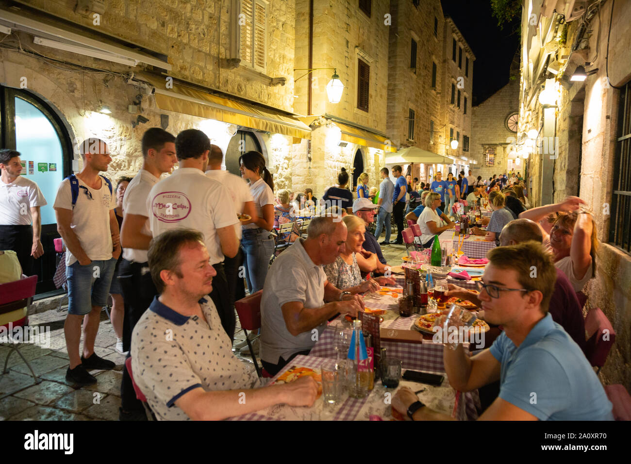 Dubrovnik restaurant, tourists eating food outdoors in Mea Culpa restaurant, Dubrovnik old town, in summer; Dubrovnik Croatia Europe Stock Photo