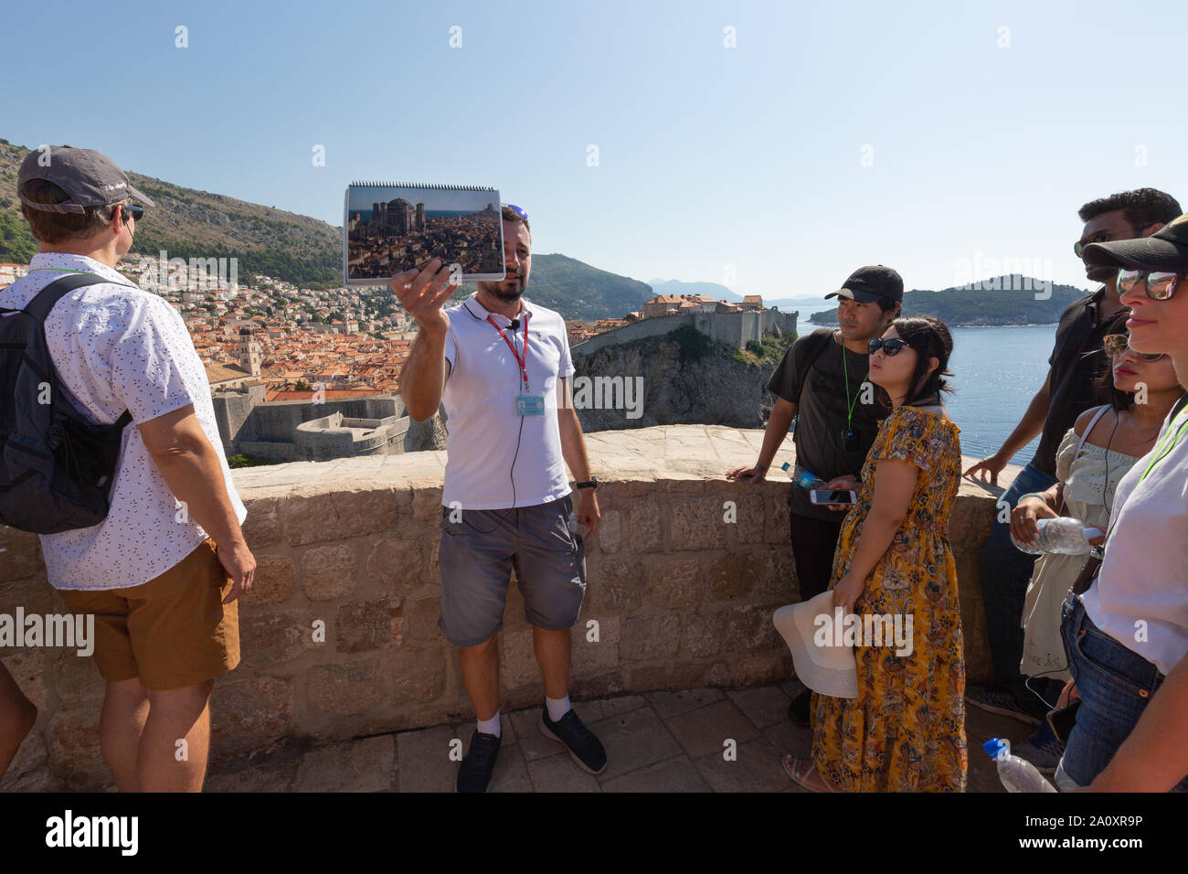 Dubrovnik Game of Thrones; tourists and tour guide on a guided tour of Game of Thrones filming locations, Dubrovnik old town, Dubrovnik Croatia Europe Stock Photo