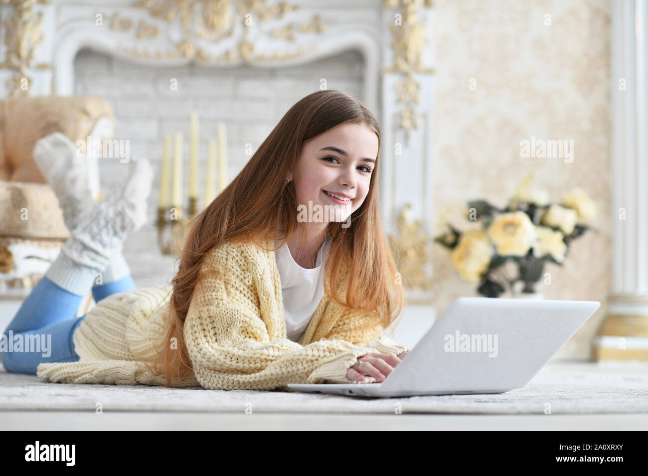 Portrait of beautiful teen girl lying on floor Stock Photo - Alamy