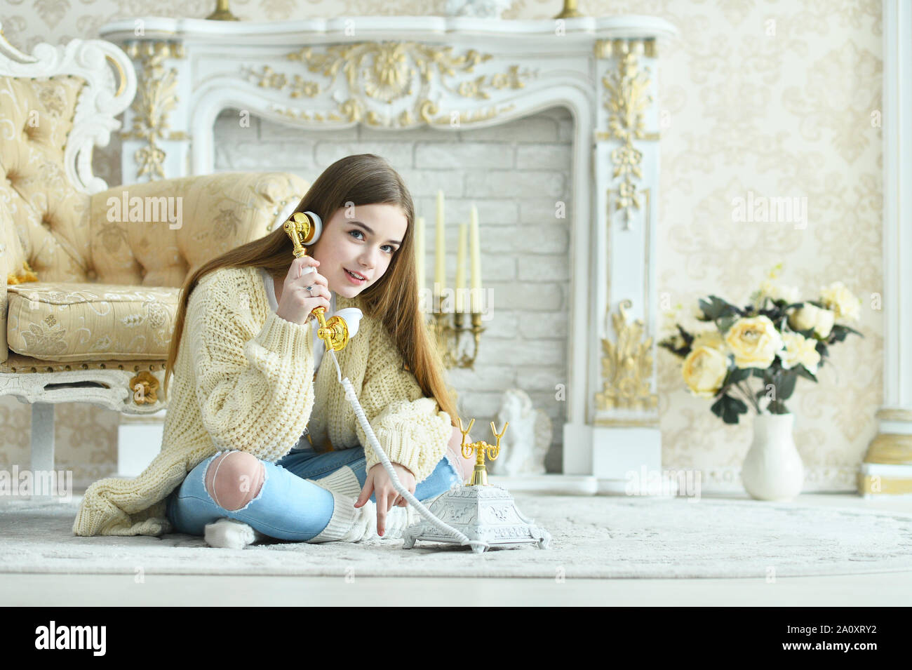 Portrait of beautiful teen girl sitting on floor Stock Photo - Alamy