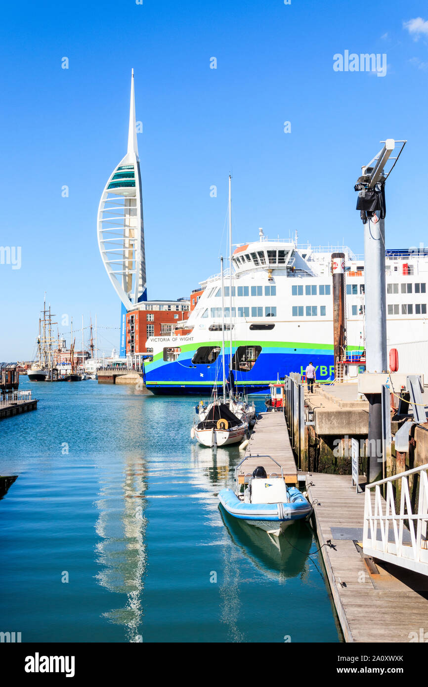 An Isle of Wight car ferry emerging from the Portsmouth Harbour, the Emirates Spinnaker Tower in
