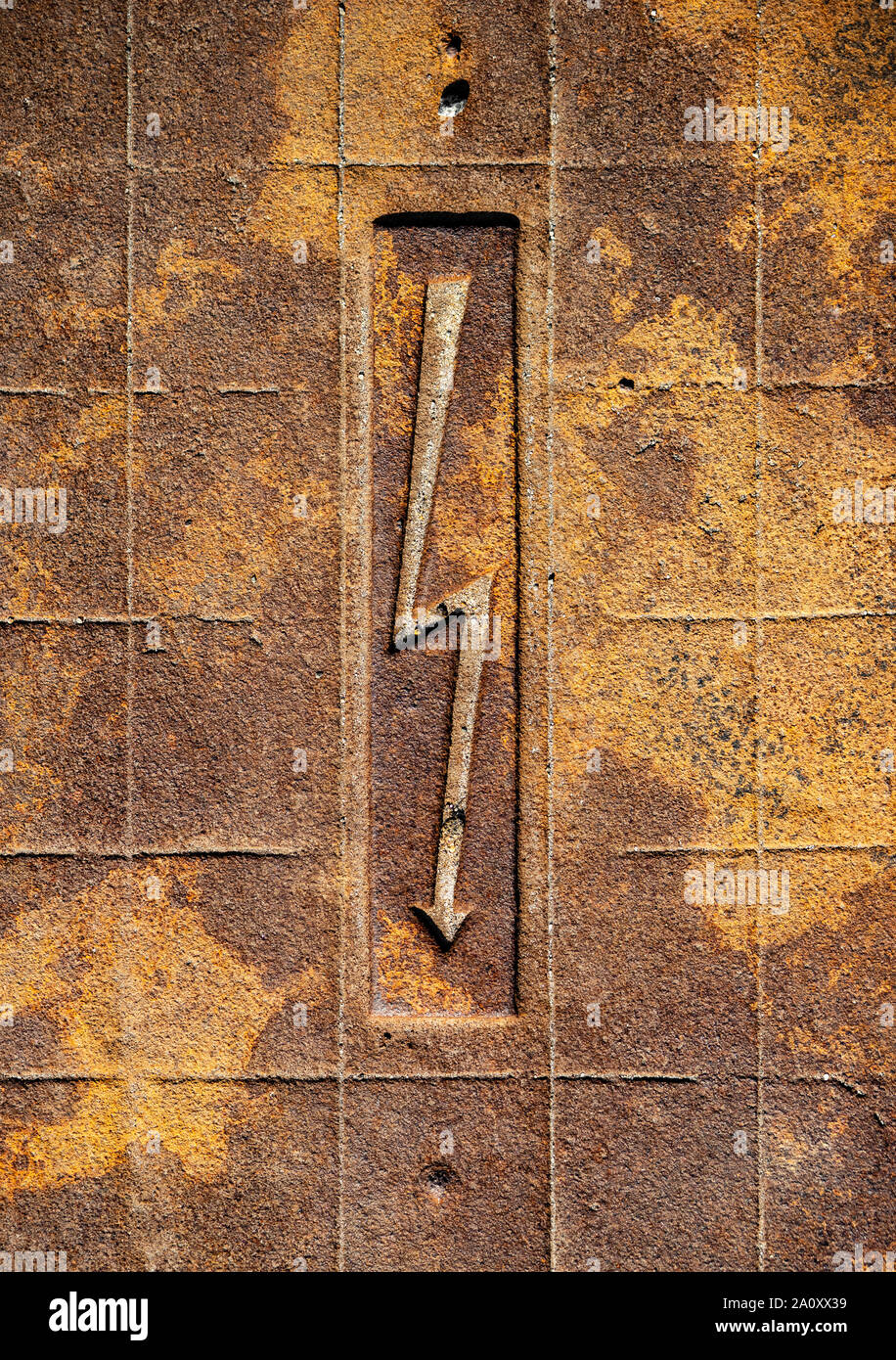 High voltage sign on grunge rusty metal surface Stock Photo