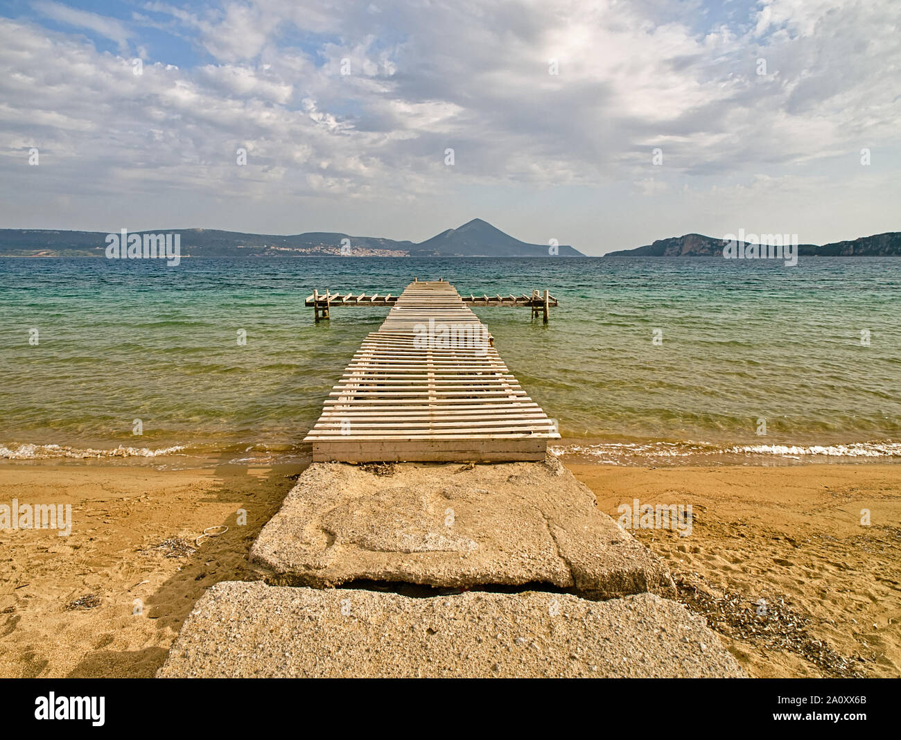 Rough wooden pier, over sea water, Gialova lagoon, Peloponnese, Greece. Stock Photo