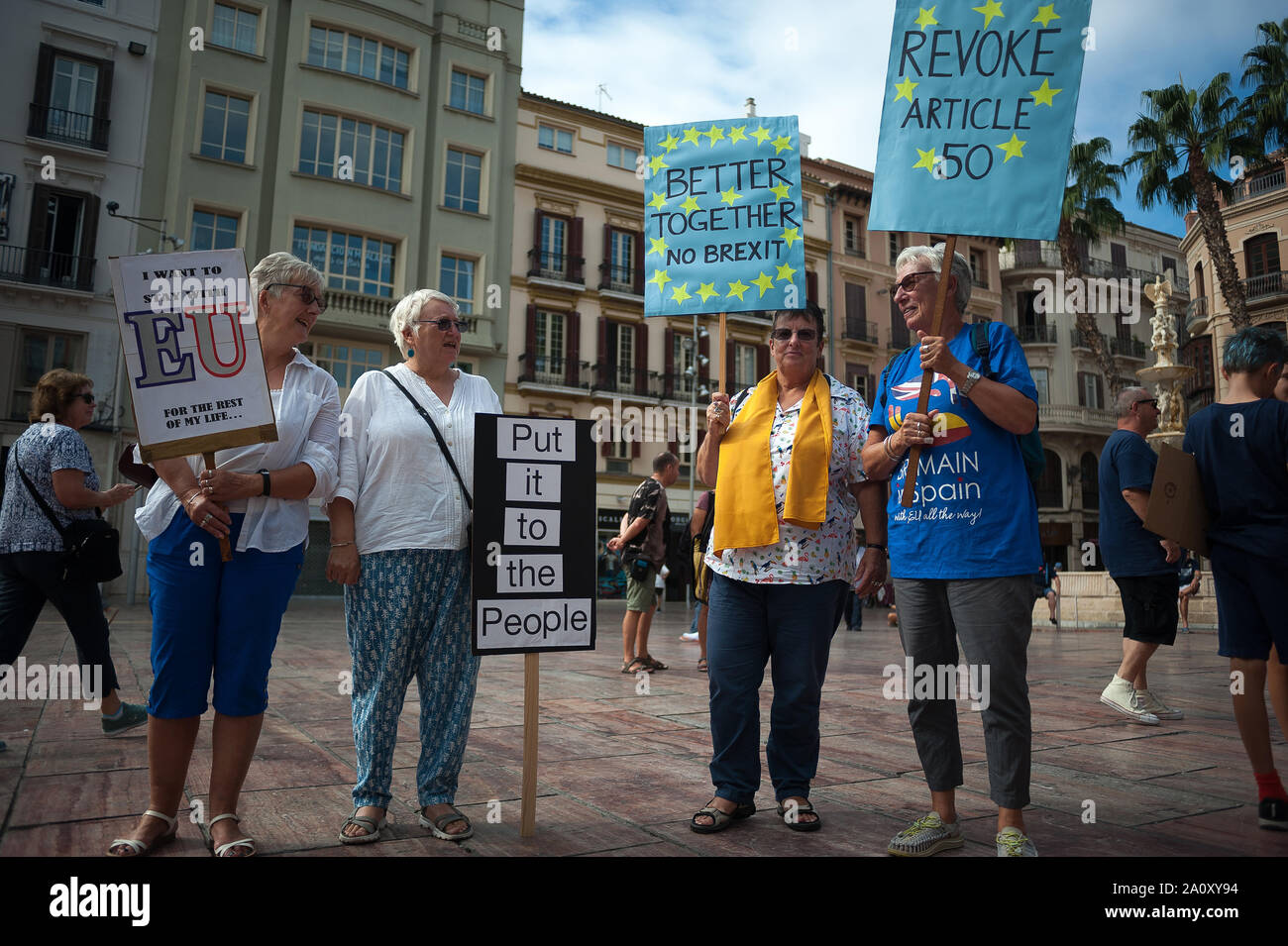 Anti-brexit demonstrators holding placards during the protest.A group of British people living in Malaga demand to protect the rights that UK Nationals living in Spain currently hold and show support to their Spanish friends who live in the UK, by protesting against the UK leaving Europe. Stock Photo