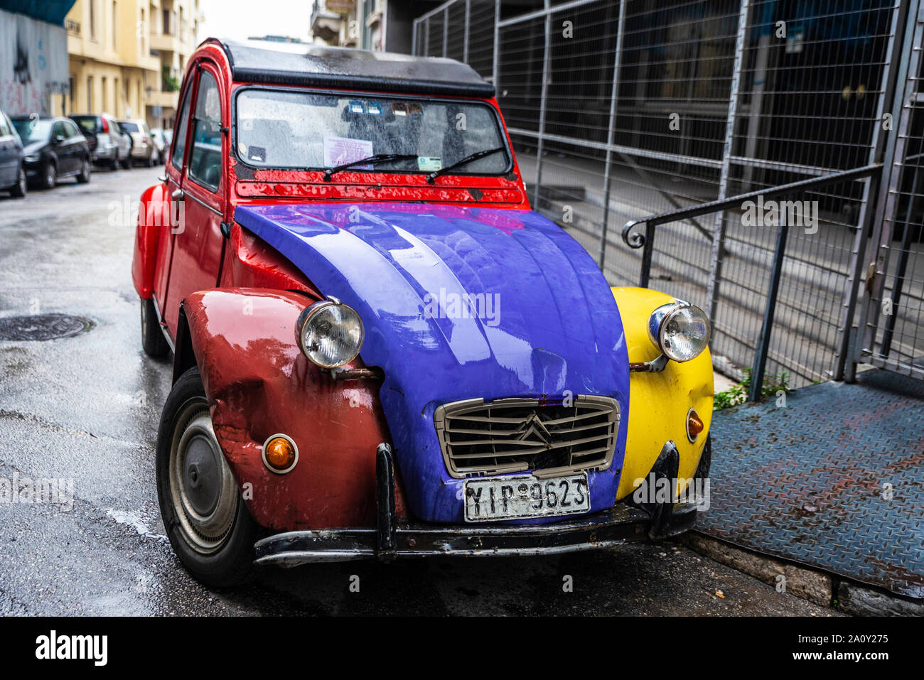Athens, Greece - December 31, 2018: Red, yellow and blue Citroen 2CV (two steam horses or two tax horsepower) car parked on a street in Athens, Greece Stock Photo