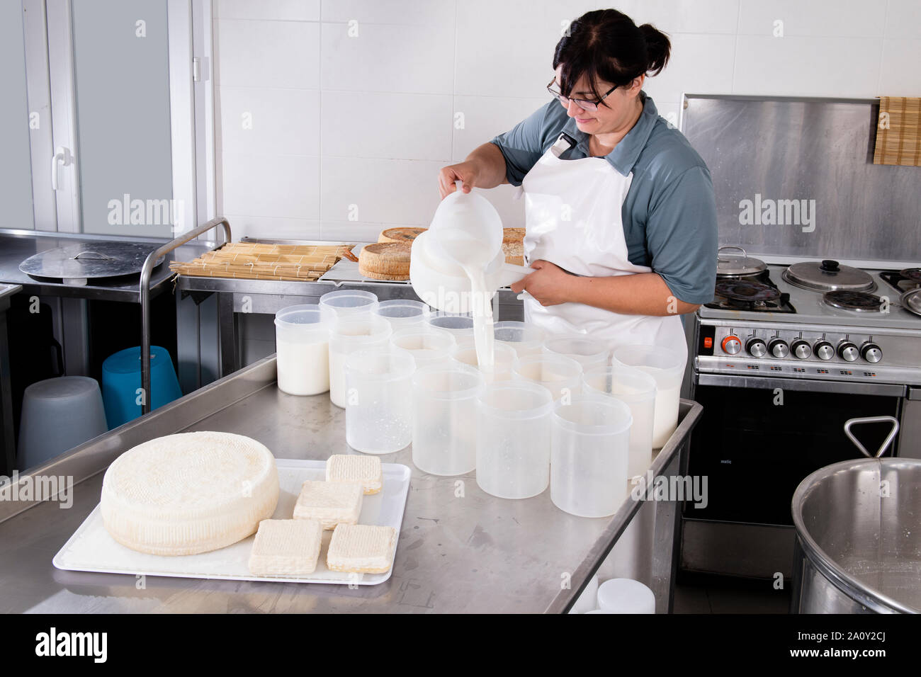 Cheesemaker pours milk hi-res stock photography and images - Alamy