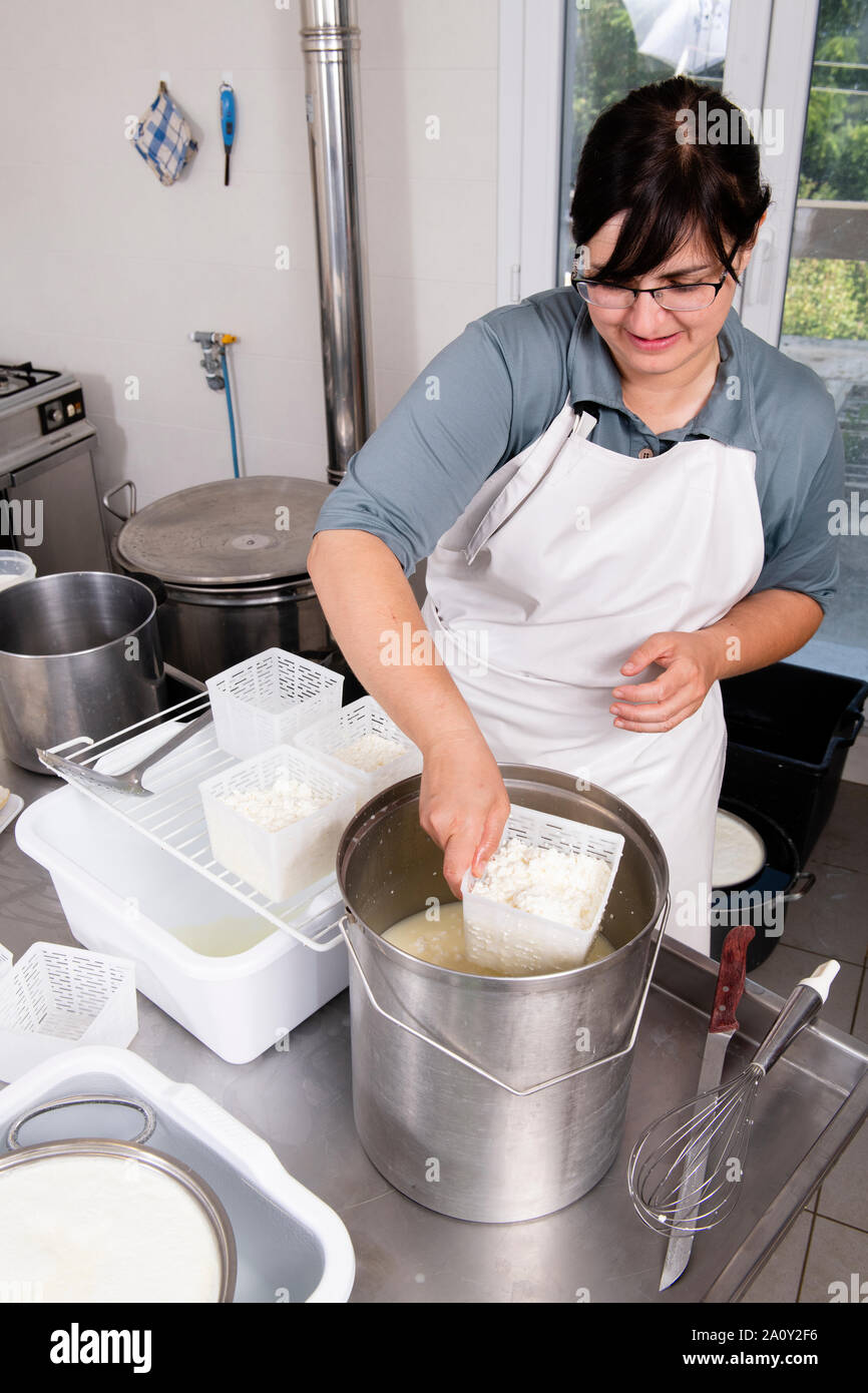 Cheesemaker pours milk hi-res stock photography and images - Alamy