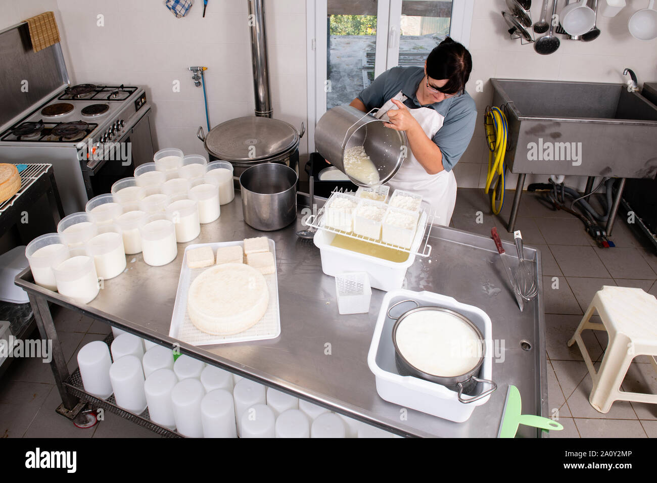 Cheesemaker pours milk hi-res stock photography and images - Alamy