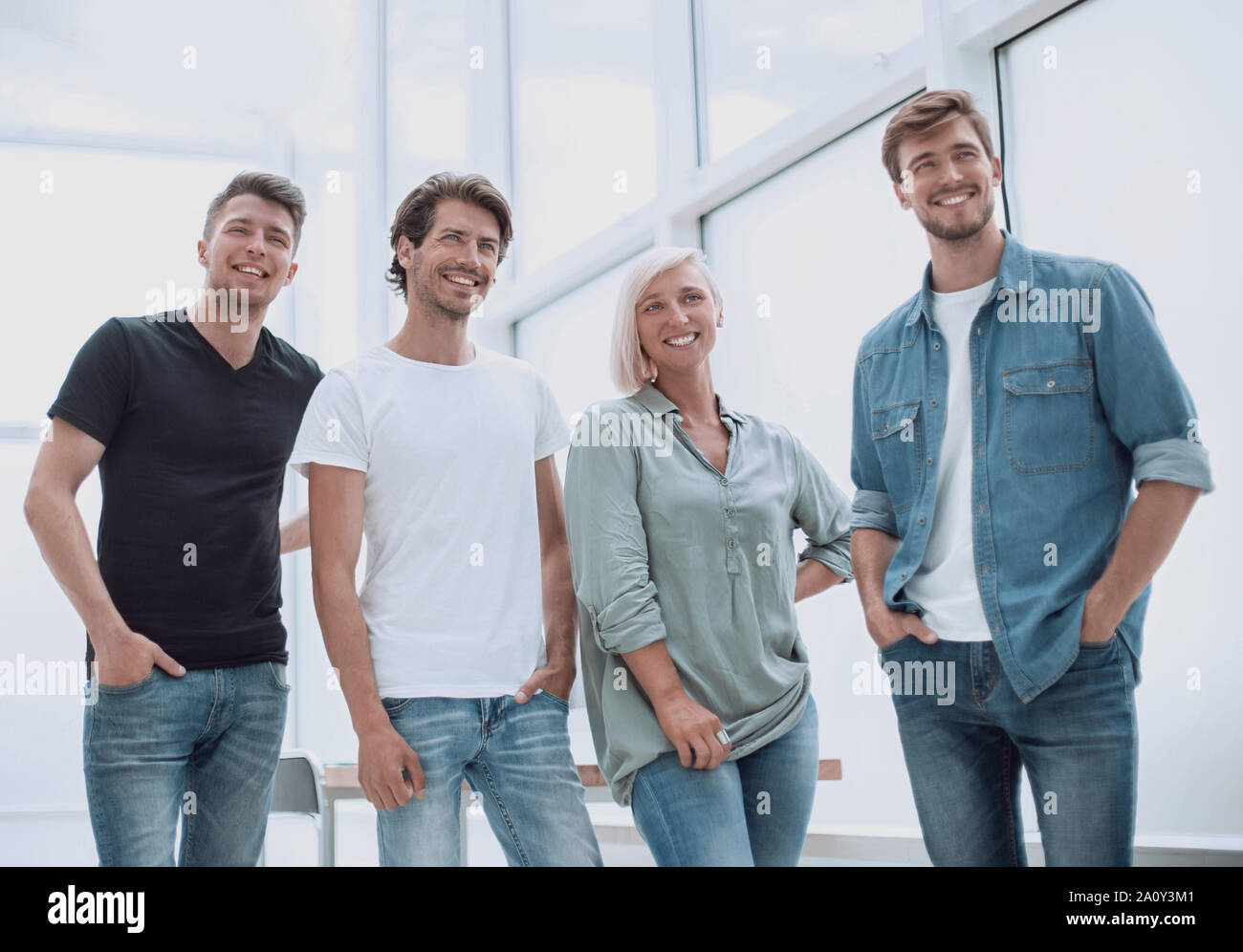 group of successful young people standing in the office Stock Photo - Alamy