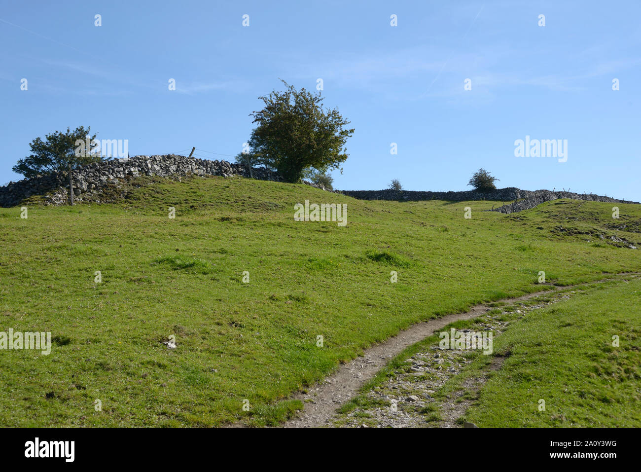 Track leading into fields on hill side, Derbyshire. Stock Photo