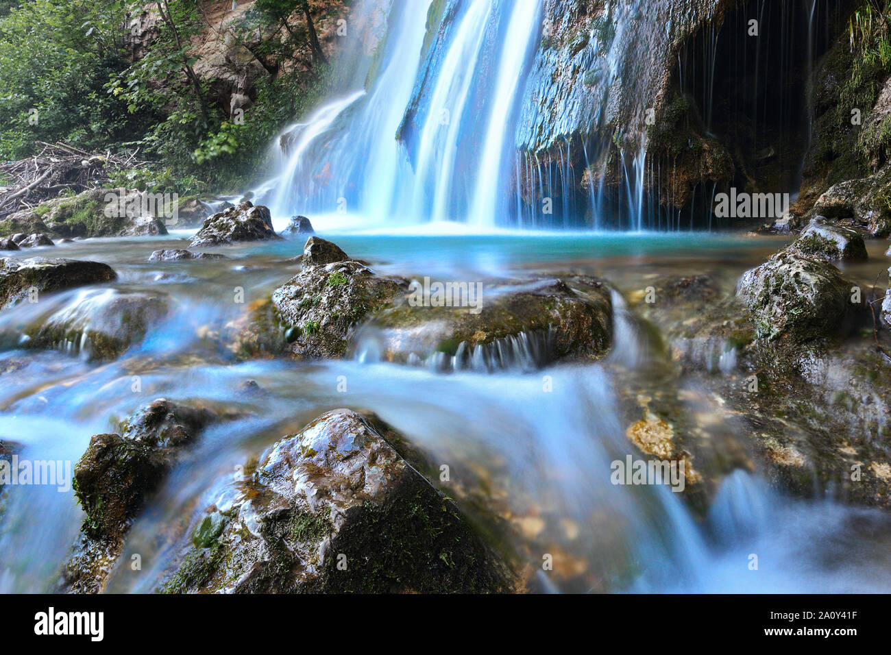 closeup of blue water mountain stream in Romania Stock Photo