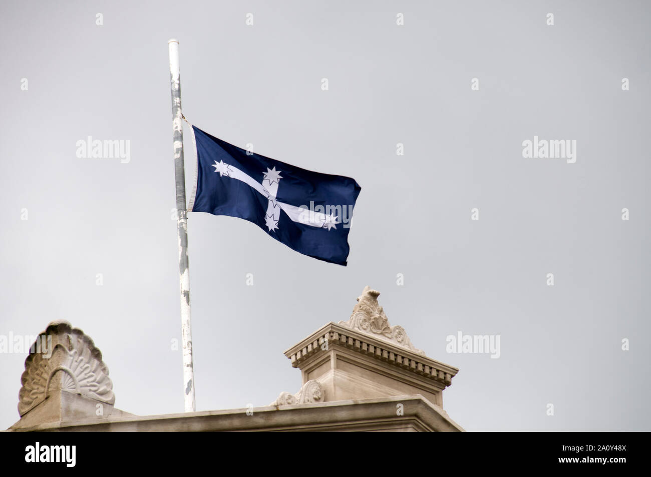 The Blue Eureka flag being flown above the town hall in Ballarat in the State of Victoria, Australia.    The Eureka flag was a War Flag used by the Eu Stock Photo