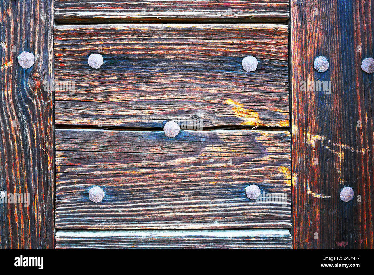 details of a wooden door surface, planks mounted with rivets Stock Photo Alamy