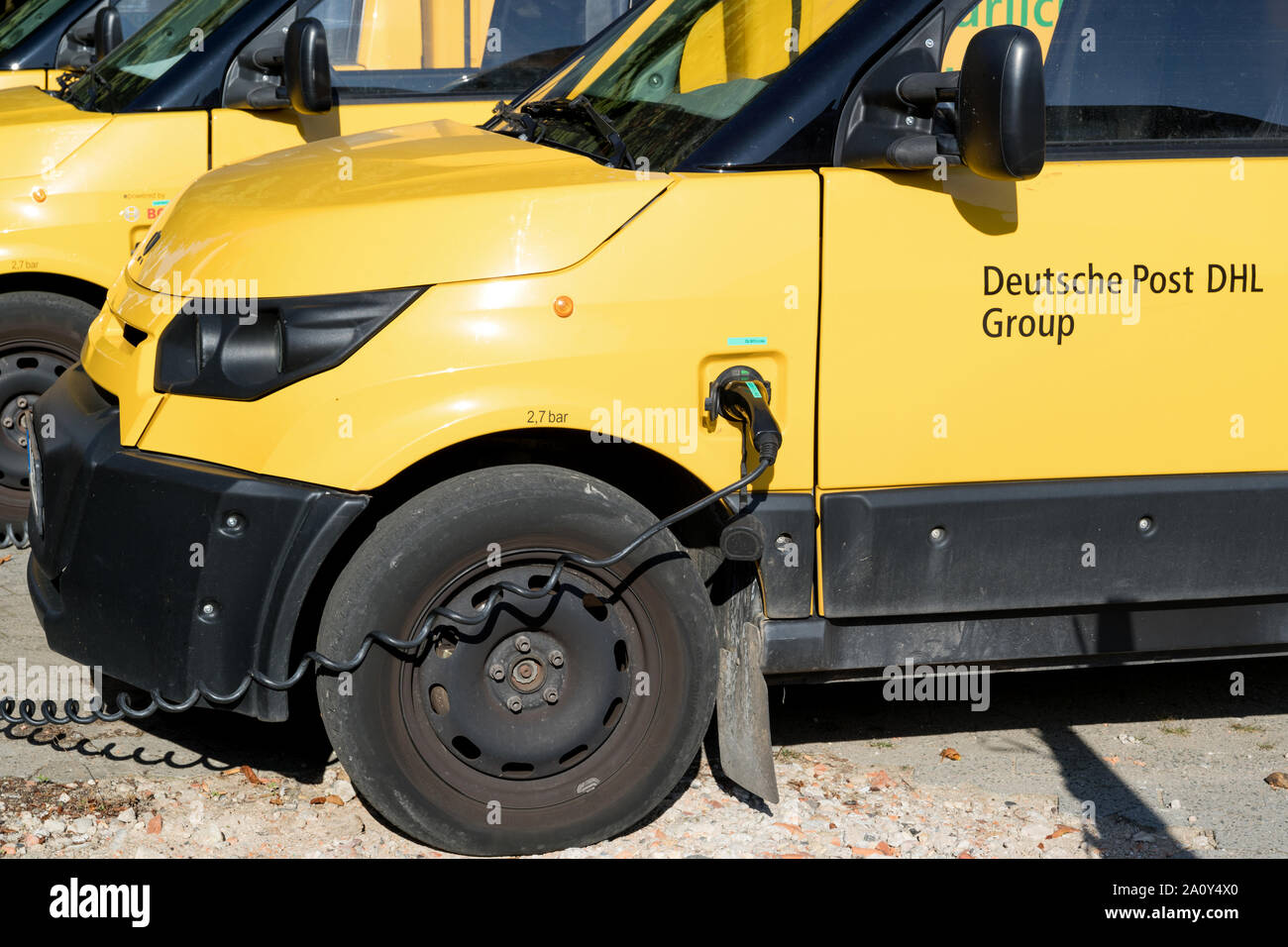 StreetScooter Work of Deutsche Post DHL being charged. Stock Photo