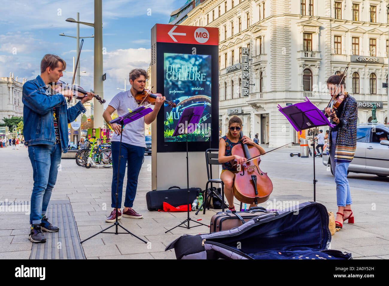 Young classical music school students playing on busy street in Vienna, Austria. Stock Photo