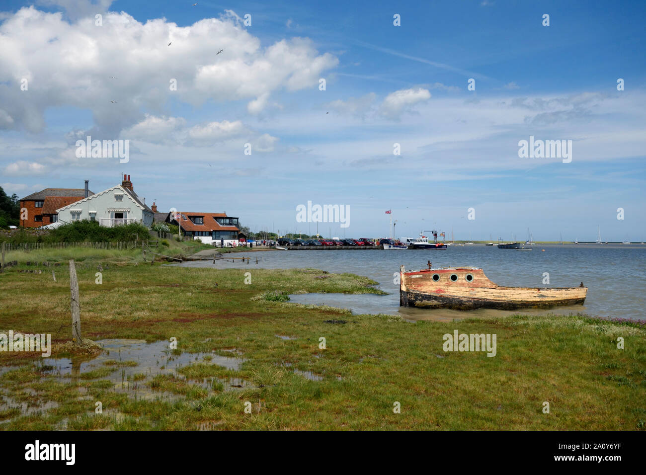 The wreck of a boat by the tidal estuary of the river Ore at Orford Stock Photo